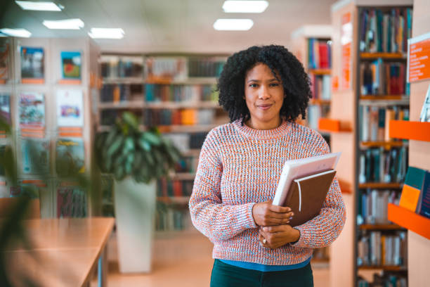 istock Hispanic Mid Adult Female In A Library 1455947863