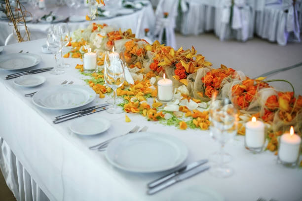 istock Holiday table setting decorated with flowers and candles. 1455949458