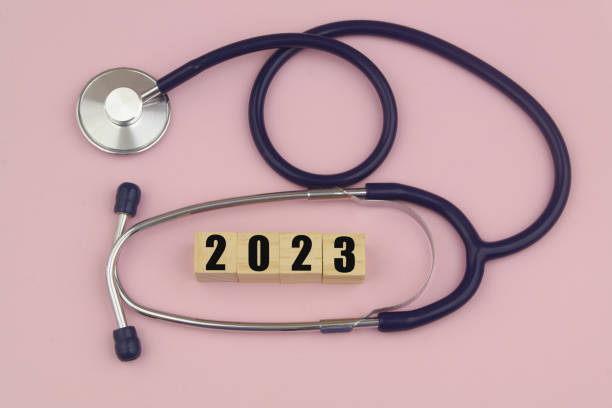istock Stethoscope and numbers  2023 on wooden cubes. 1455950647