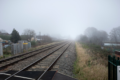 Railroad Tracks Disappearing Into The Fog