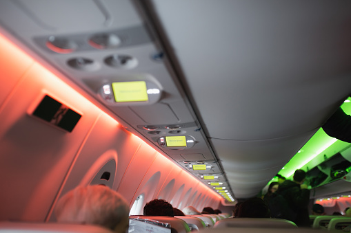 Paris, France - December 28, 2022: Information LCD screens for passengers in the cabin - have a nice flight