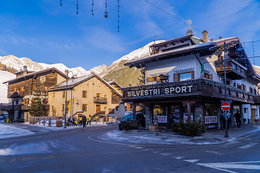 Livigno, Italy – January 12, 2022: The traditional alpine houses with shops and people