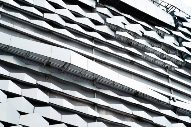 istock modern Aluminium composite material architecture gray color and Hexagon shape popup texture on exterior facade building. 1455955191