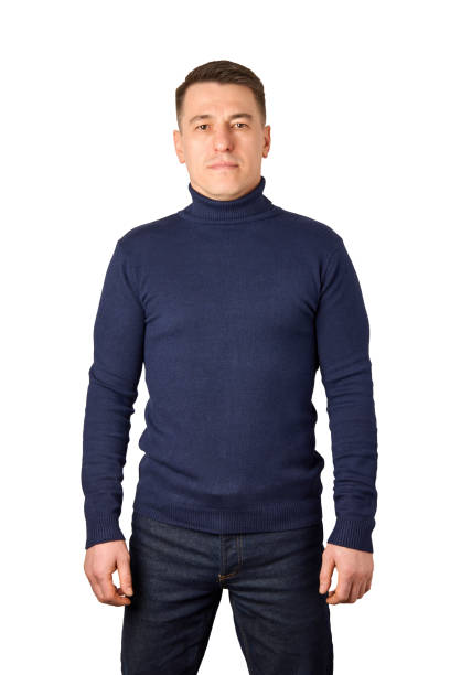 istock Young man wearing blue turtleneck sweater and jeans 1455957281