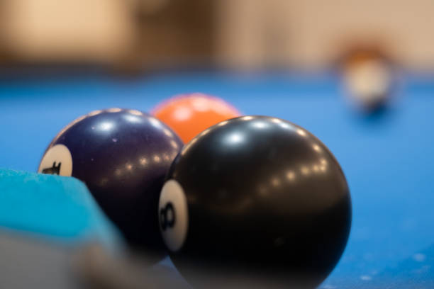 istock Multicolored billiards, billiard balls on a blue table, colored balls on a billiard table, play snooket 1455958177