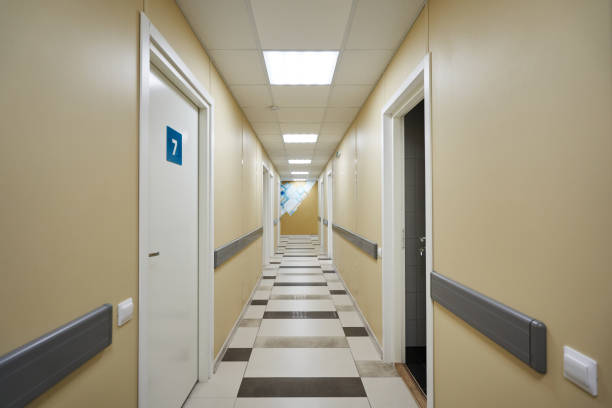 istock corridor with open and closed doors with numbers on it. hospital corridor with wards 1455958179