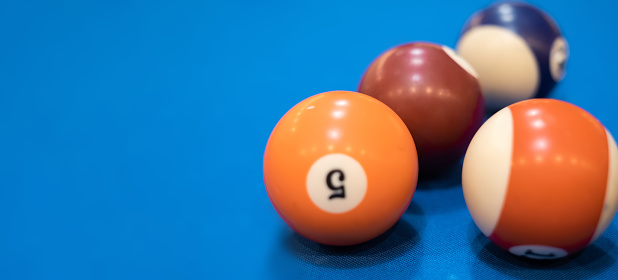 Multicolored billiards, billiard balls on a blue table, colored balls on a billiard table, Russian billiards, play snooket
