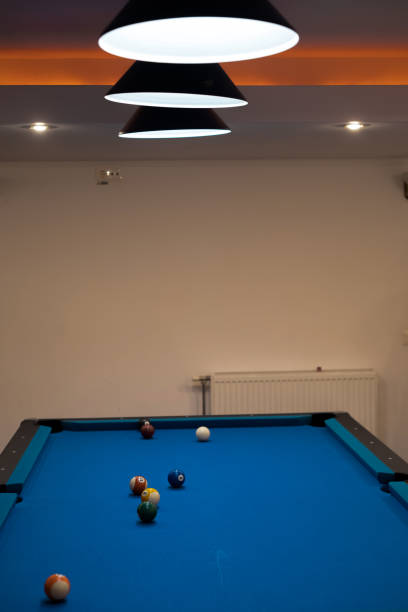 istock Multicolored billiards, billiard balls on a blue table, colored balls on a billiard table, play snooket 1455958326
