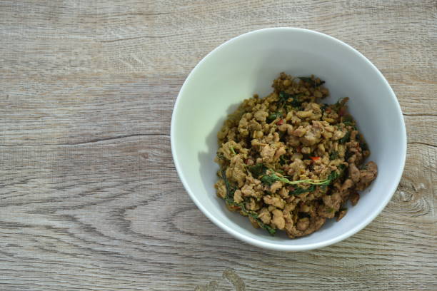 istock spicy stir fried chop pork with chili and basil leaf 1455958396