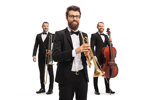 Elegant male musicians with a trombone, trumpet and cello isolated on white background