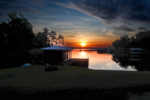 Various textured clouds frame this morning sunrise taken in our cove on beautiful Lake Sinclair (Milledgeville, Georgia).