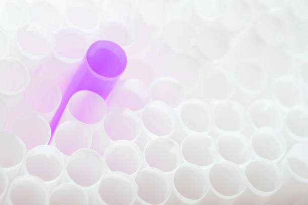 Violet color plastic tube with white color plastic tubes all around