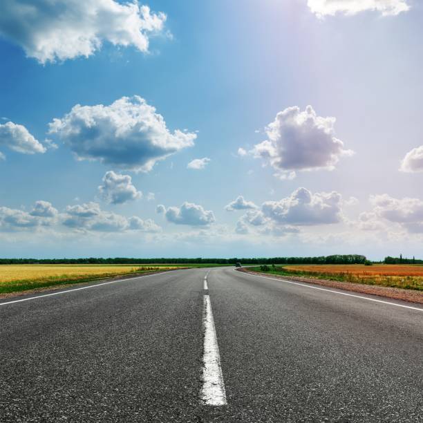 istock asphalt road with white line to cloudy horizon 1455965216