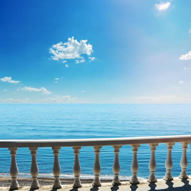 istock white balcony over sea and blue sky 1455965340