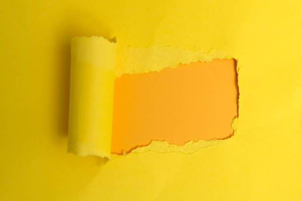 Yellow and orange color torn paper