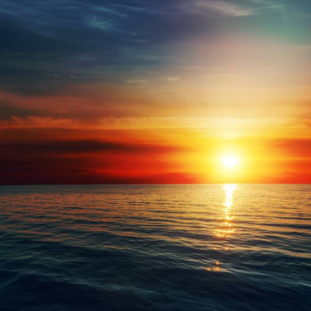 istock good red sunset over darken sea 1455966004