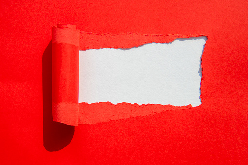 Red and white color torn paper