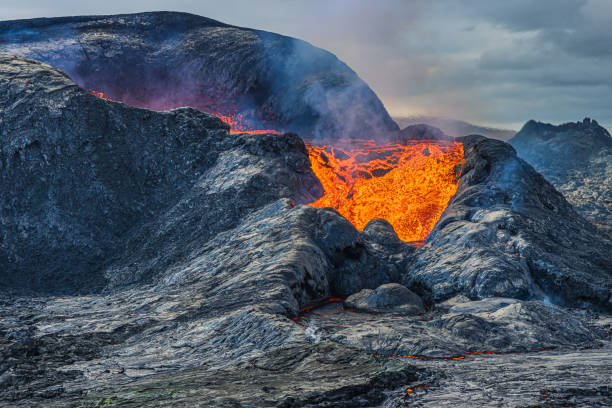 istock View into volcanic crater during volcanic eruption 1455967423
