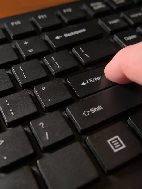 istock A person's finger pressing the Enter key on a black computer keyboard. Close up, macro shot 1455967599