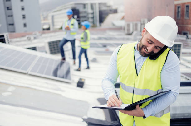 istock Construction, phone call and businessman writing checklist during building inspection on the roof. Engineer, architect and builder on mobile communication outside on an industrial site with notes 1455979220