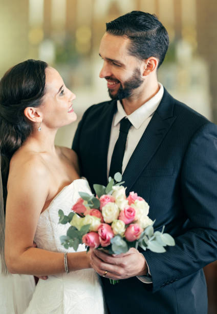 istock Man, woman and love at wedding for affection, romance and commitment ceremony in a church. Marriage, married and husband and wife celebrating after loving, caring and romantic people event 1455979333