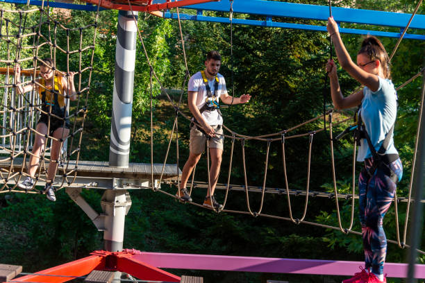 istock A group of young people have fun on the Adventure Ropeway. 1455980164