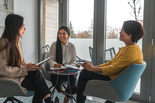 istock Three Asian Females Working With Wireless Technology 1455985525