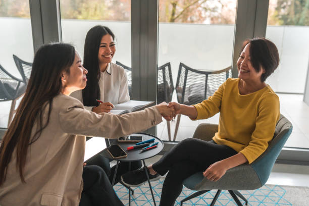 istock Three Asian Females Working With Wireless Technology 1455985551