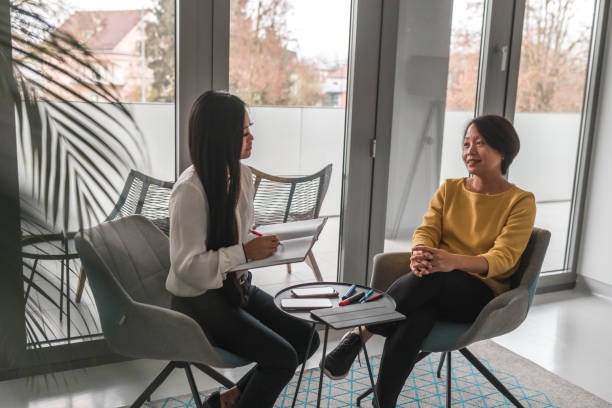 istock Asian Businesswomen Discussing At Work 1455985563