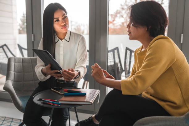 istock Asian Businesswomen Discussing At Work 1455985575