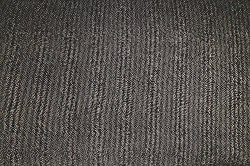 Texture of dark gray fabric, velvet. Abstract grey background, copy space.