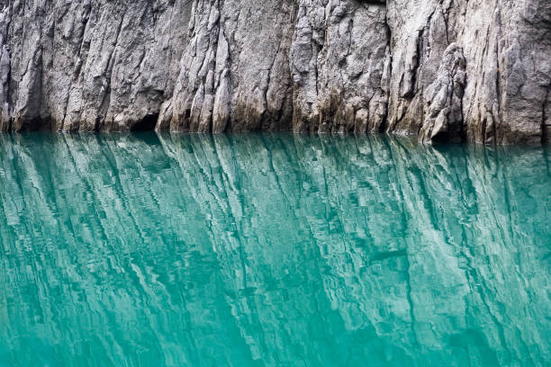 rock formation in the reflection of water. nature of the green canyon in turkey. selective focus. - rock strata natural pattern abstract scenics imagens e fotografias de stock