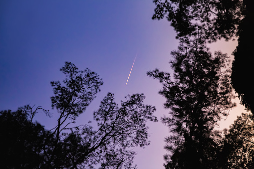 A bright comet in the sky, a shooting star. Comet tail at sunset. Selective focus.