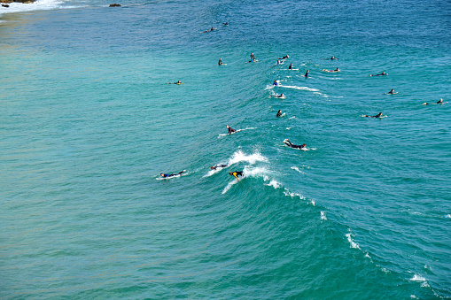 Zavial, Portugal, 09-19-2020
Surfers in nice waves at Zavial beach (Praia do Zavial)  at the Algarve coast