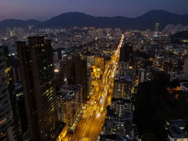 A beautiful drone shot of a Prince Edward Road in the nighttime in Hong Kong.