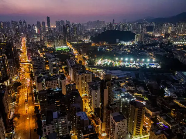 A beautiful drone shot of a Prince Edward Road in the nighttime in Hong Kong.
