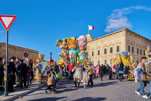 Annual Mardi Gras Fat Tuesday grand parade on maltese street of allegorical floats and masquerader procession: Valletta, Malta - February 23, 2020