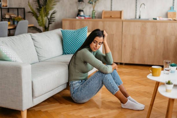 istock Young Woman Having A Headache At Home 1455993663