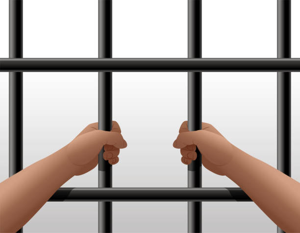 istock Man In Prison, Hands Holding Steel Cage Jail Bars 1455993947