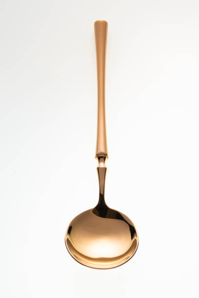 istock Golden spoon isolated on white background. 1455995681