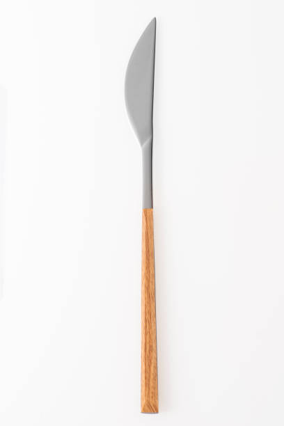 istock Wooden silver knife isolated on white background. Studio shot. 1455996048