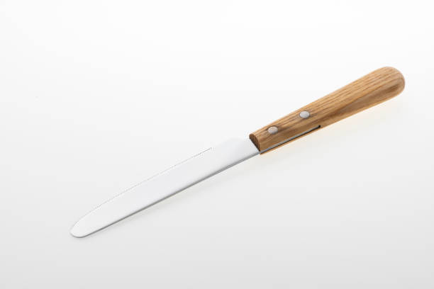 istock Wooden silver knife isolated on white background. Studio shot. 1455996054