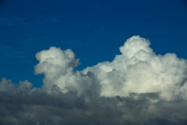 istock Dramatic Cloudscape in the blue sky. Multiple layers Clouds from far composed of dark and white Clouds. 1455998310