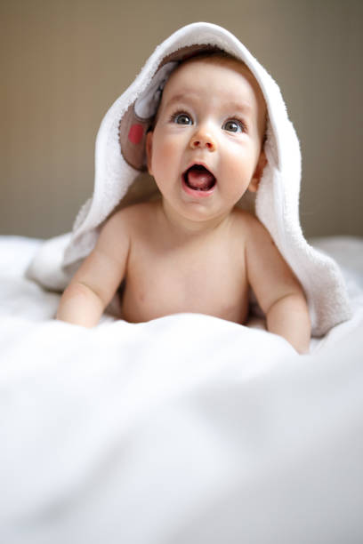istock Baby wearing towel after bath 1455999606
