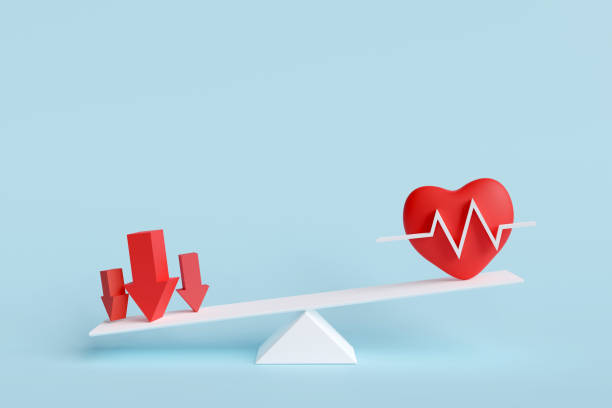 istock Red heart with red arrow on scale unbalanced indicates negative effects and risks to health. 1455999805