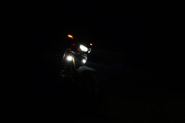 istock Motorcycle lights at night in darkness 1456001204