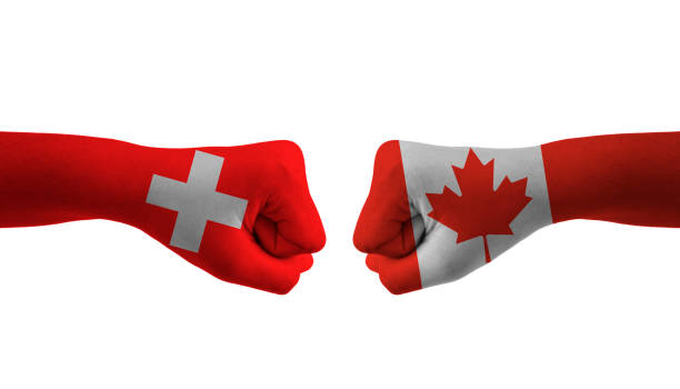 istock Canada VS switzerland hand flag Man hands patterned football world cup 1456005040