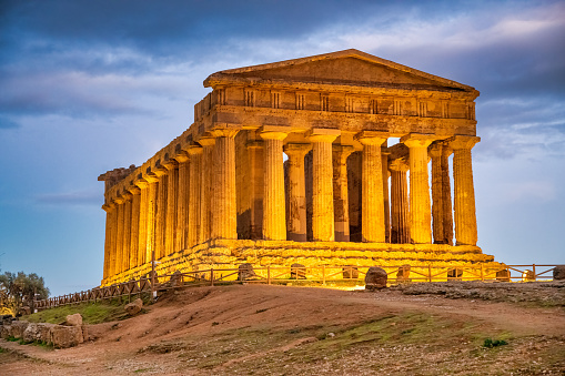 Temple of Concordia in the Valley of the Temples at sunset in Agrigento - Sicily, Italy