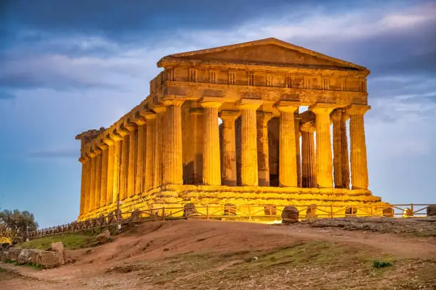 Temple of Concordia in the Valley of the Temples at sunset in Agrigento - Sicily, Italy