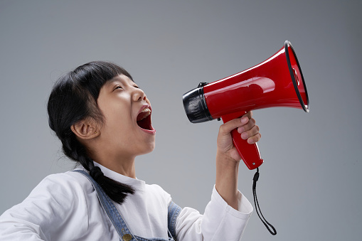 excited girl  shouting using megaphone